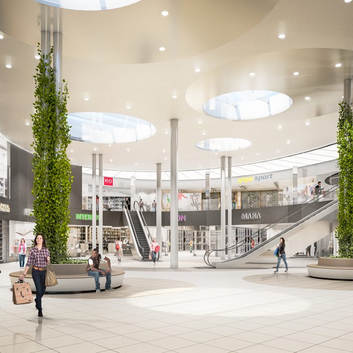 Ein geräumiges, modernes Einkaufszentrum mit hohen Decken und runden Oberlichtern. Die Käufer gehen und sitzen auf Bänken. Verschiedene Ladenschilder, wie zum Beispiel „SPAR“, sind sichtbar. Zwei zentrale Säulen sind von Grün umgeben, was einen Hauch von Natur verleiht.