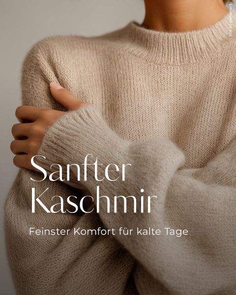 Eine Person trägt einen weichen, beigen Kaschmirpullover mit verschränkten Armen. Der Text auf Deutsch lautet: "Sanfter Kaschmir. Feinster Komfort für kalte Tage.