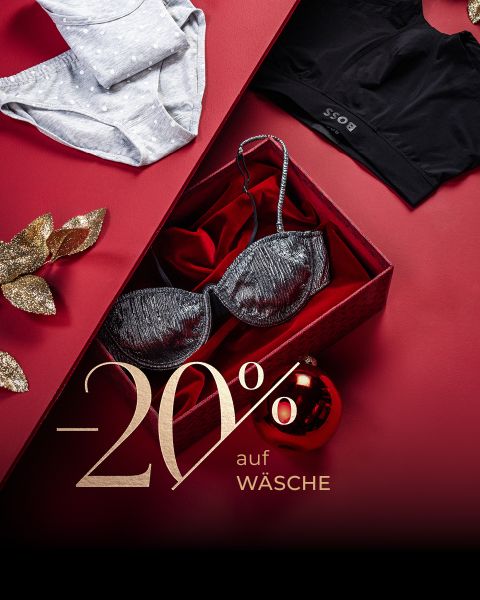 Schwarzer BH in einer roten Geschenkbox, Unterwäsche-Sets und goldene Verzierung auf rotem Hintergrund. Text: "-20% auf Wäsche" (20% Rabatt auf Dessous/Unterwäsche).