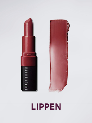 Auf hellem Hintergrund sind eine Lippenstifthülse und ein Strich Lippenstift abgebildet. Der Lippenstift hat eine satte, malvenfarbene Farbe. Darunter steht in fetten Buchstaben das Wort „LIPPEN“.