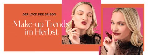 Eine Frau mit blondem Haar und einem durchsichtigen schwarzen Oberteil posiert vor einem rosa und orangefarbenen Hintergrund. Auf einem Bild hält sie Lippenstift und schürzt die Lippen, während sie auf dem anderen mit aufgetragenem Lippenstift lächelt. Der Text lautet: „Der Look der Saison: Make-up-Trends im Herbst.“.