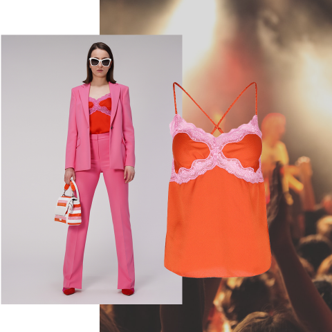 Eine Frau in einem rosafarbenen Kostüm mit einem rot-rosa Spitzenunterhemd steht selbstbewusst da, trägt eine weiße Sonnenbrille und hält eine gestreifte Handtasche. Neben ihr ist eine Nahaufnahme des Unterhemds zu sehen. Im Hintergrund ist eine verschwommene Menschenmenge bei einem Konzert zu sehen.