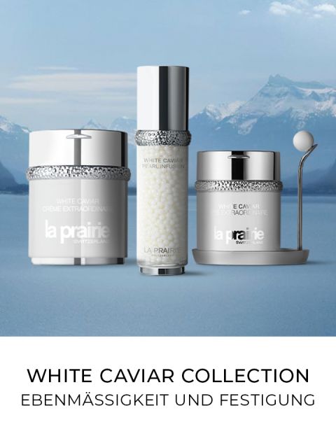 Anzeige von drei La Prairie-Hautpflegeprodukten aus der White Caviar Collection vor einer Bergkulisse mit einem See. Unten steht auf Deutsch der Text „EBENMÄSSIGKEIT UND FESTIGUNG“.