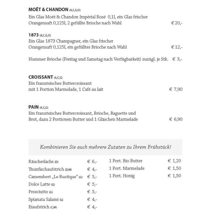 Menü mit dem Titel „FRÜHSTÜCK – bis 12:00 Uhr“ mit Frühstücksoptionen, darunter Champagner, Croissants und Pain au Chocolat. Preise und zusätzliche Artikelkombinationen sind aufgeführt, verschiedene Käsesorten und Extras sind verfügbar.