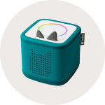 Ein blauer Toniebox-Audioplayer mit katzenförmigen Ohren auf der Oberseite und einem Lautsprechergitter in Form eines Katzengesichts auf der Vorderseite.