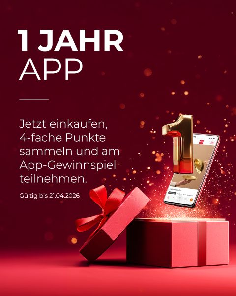 Eine goldene Zahl 1 erhebt sich aus einem Smartphone über einem roten Geschenkkarton, mit deutschem Text, der für ein 1-jähriges App-Jubiläum und eine Punkteprämienaktion wirbt.