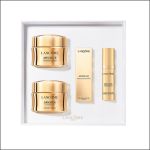 Lancôme Absolue Hautpflegeset mit zwei goldenen Cremetiegeln, einem goldenen Serumfläschchen und einer goldenen Schachtel, angeordnet auf einem weißen Tablett.